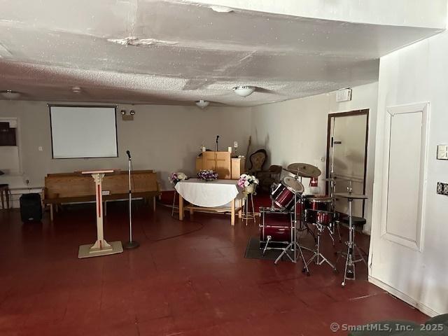 basement featuring a textured ceiling