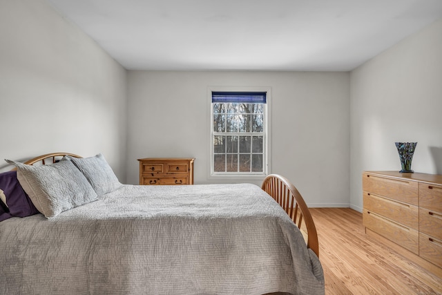 bedroom with light wood-type flooring