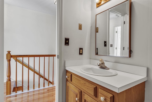 bathroom with vanity and hardwood / wood-style floors