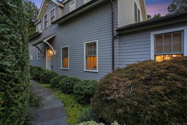 view of property exterior at dusk