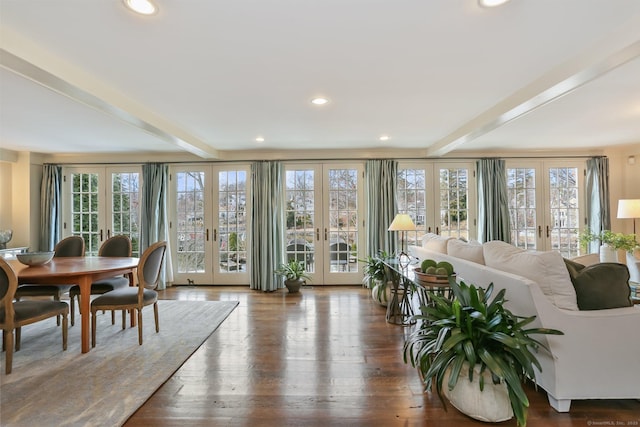 interior space with beam ceiling and french doors