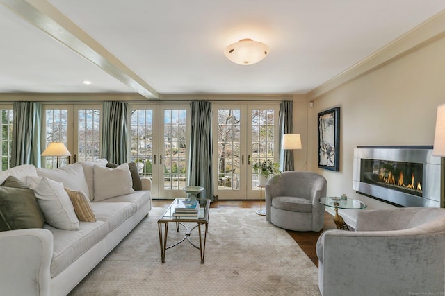 living room featuring french doors, hardwood / wood-style flooring, and beamed ceiling