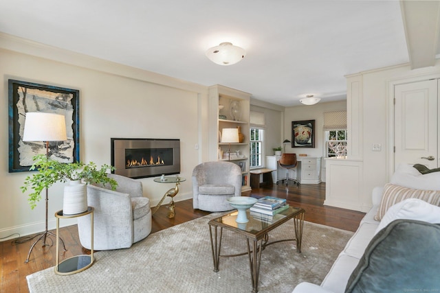 living room featuring built in desk and dark wood-type flooring