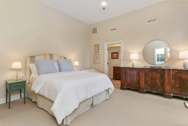 bedroom featuring light colored carpet