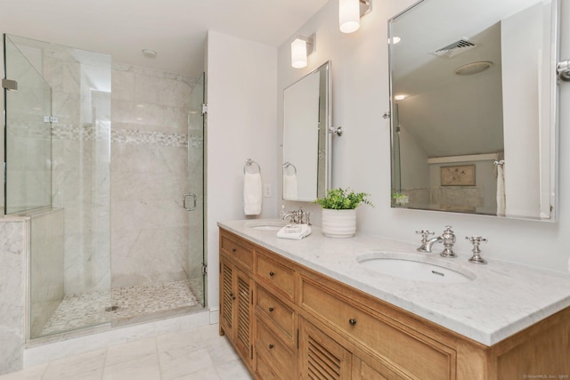 bathroom featuring vanity and a shower with shower door