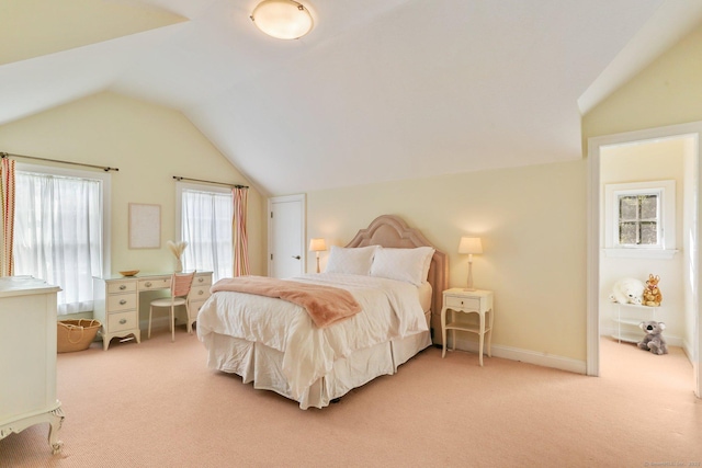 carpeted bedroom featuring vaulted ceiling