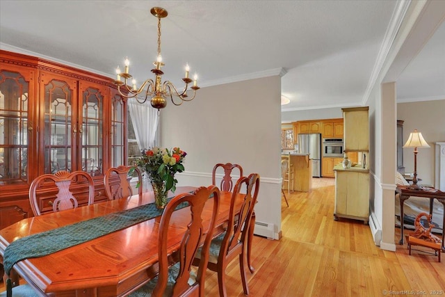 dining space featuring ornamental molding, light wood-type flooring, a notable chandelier, and baseboard heating