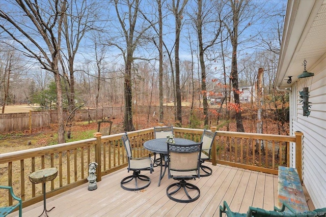 wooden deck featuring outdoor dining space and fence