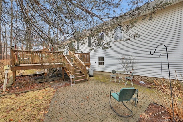 view of patio / terrace with stairway and a wooden deck