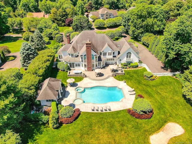 view of pool with a yard and a patio area