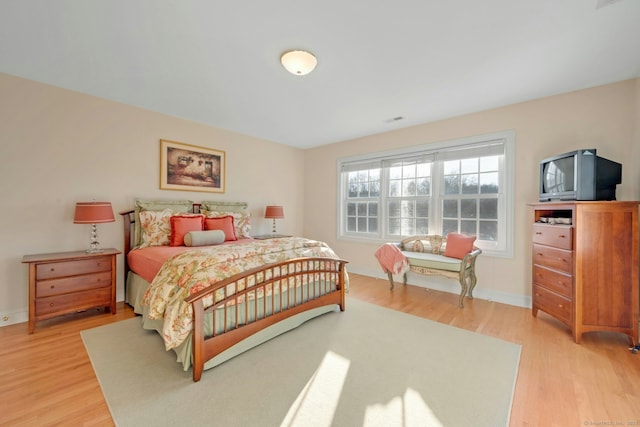 bedroom with light hardwood / wood-style flooring