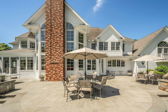 back of house with a patio