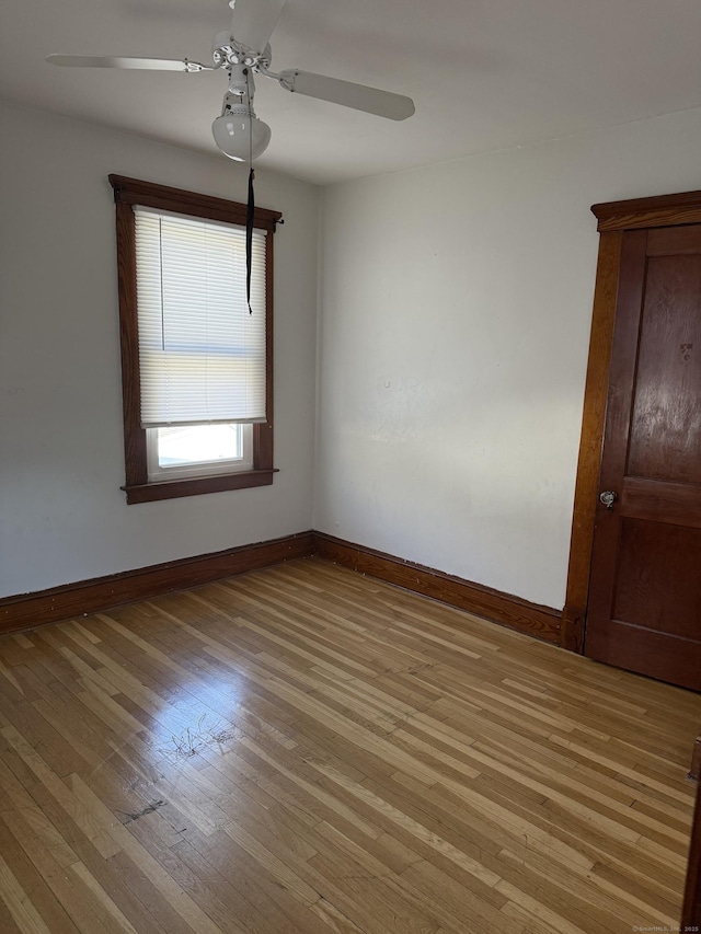 spare room with ceiling fan and light hardwood / wood-style flooring