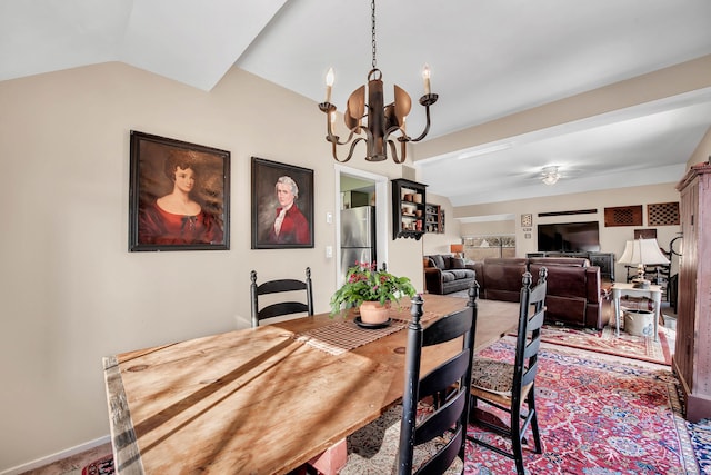 dining area featuring lofted ceiling, carpet floors, and a notable chandelier