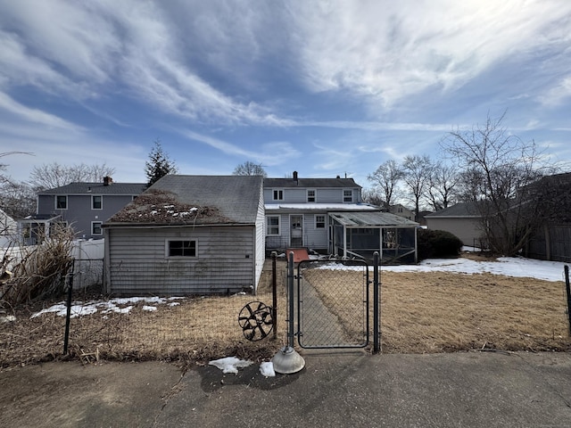 view of front of property featuring fence and a gate