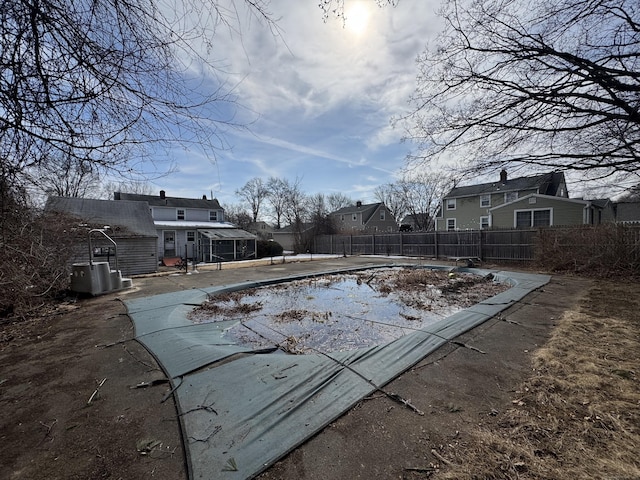 view of pool with a patio area, a residential view, fence, and a fenced in pool