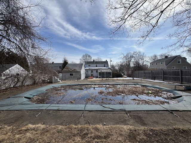 view of swimming pool featuring fence and a fenced in pool