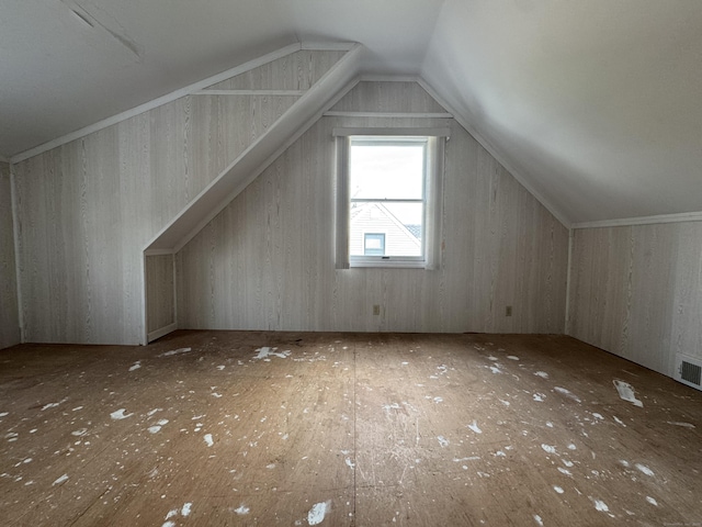 bonus room featuring lofted ceiling