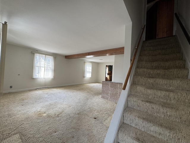 stairway with carpet floors, visible vents, and baseboards