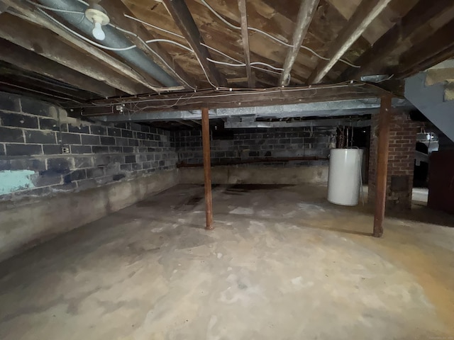 unfinished below grade area featuring gas water heater