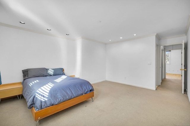 carpeted bedroom featuring crown molding