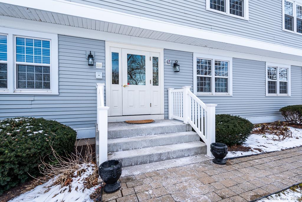 view of snow covered property entrance