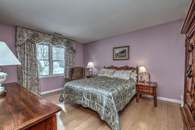 bedroom featuring light hardwood / wood-style floors