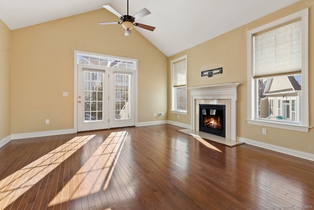 unfurnished living room with vaulted ceiling, dark wood-type flooring, and ceiling fan