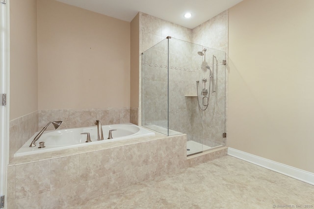 bathroom with shower with separate bathtub