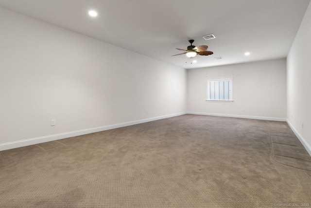 carpeted empty room with ceiling fan