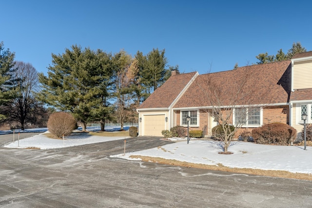 cape cod house with a garage