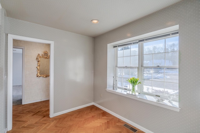 empty room featuring light parquet flooring