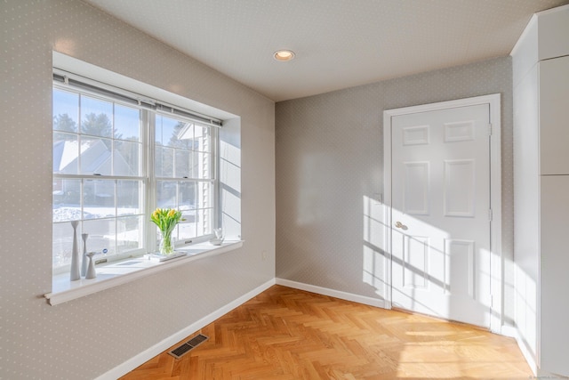 spare room featuring light parquet flooring