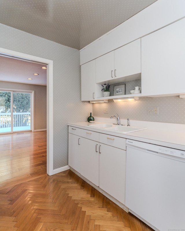 kitchen featuring white cabinetry, sink, decorative backsplash, light parquet floors, and white dishwasher