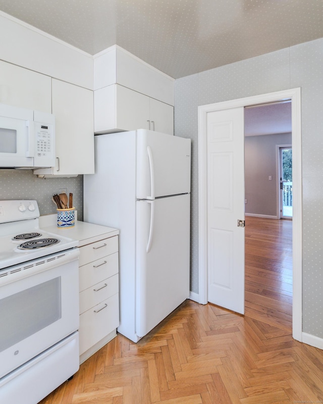 kitchen with tasteful backsplash, white appliances, light parquet floors, and white cabinets