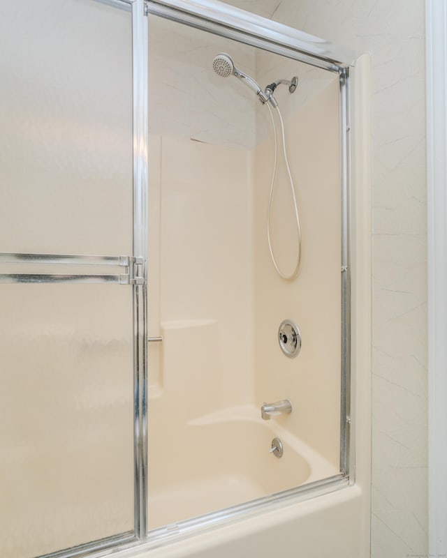 bathroom featuring enclosed tub / shower combo