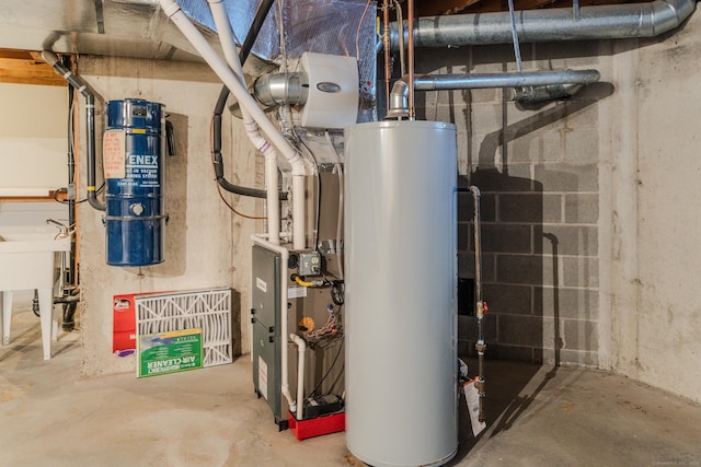 utility room with gas water heater