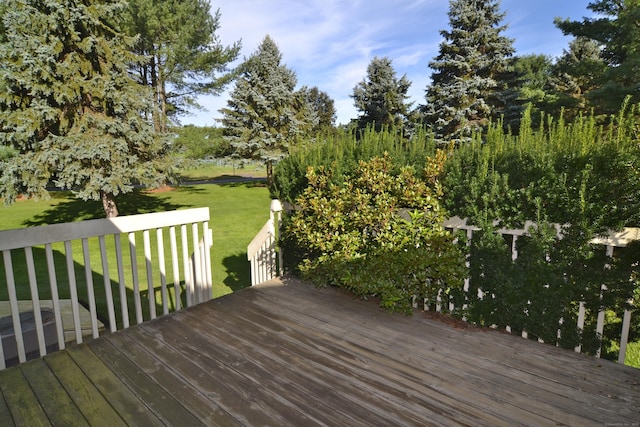 wooden terrace with a lawn