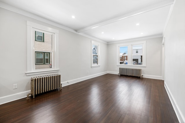 unfurnished living room featuring ornamental molding, dark hardwood / wood-style flooring, and radiator