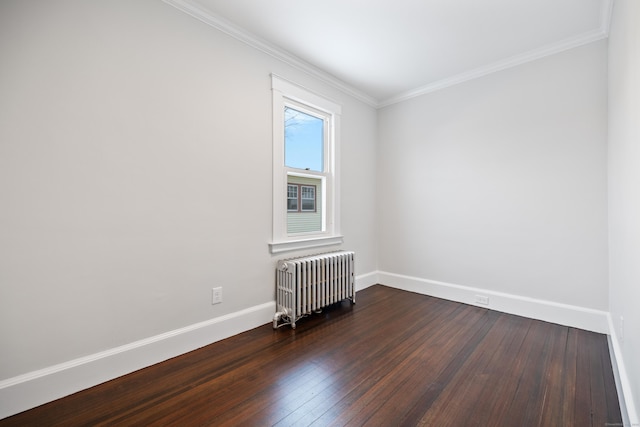 empty room with radiator, crown molding, and dark wood-type flooring