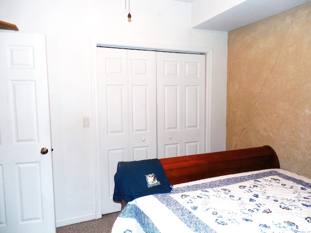 carpeted bedroom featuring a closet