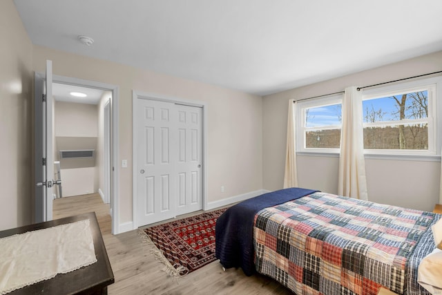 bedroom with a closet and light wood-type flooring