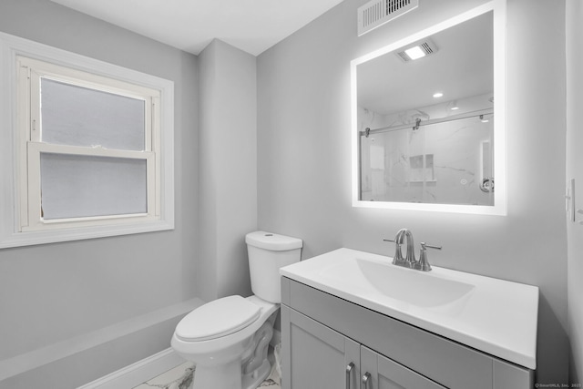 bathroom with vanity, toilet, and walk in shower