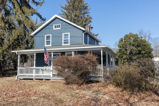 farmhouse inspired home with a porch