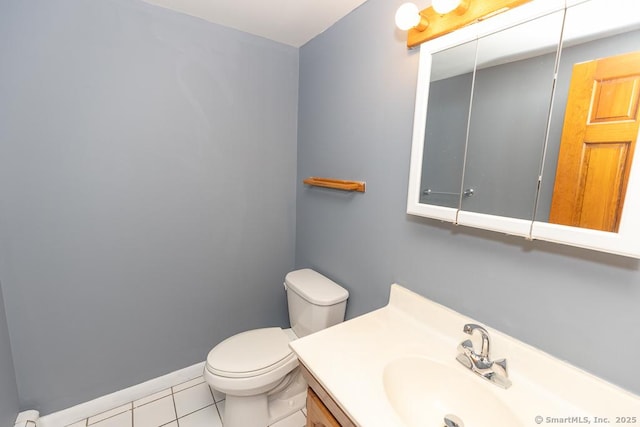 bathroom with vanity, tile patterned floors, and toilet