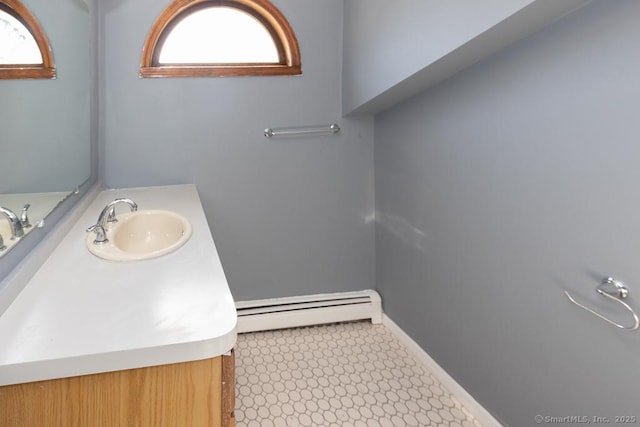 bathroom with vanity and a baseboard heating unit