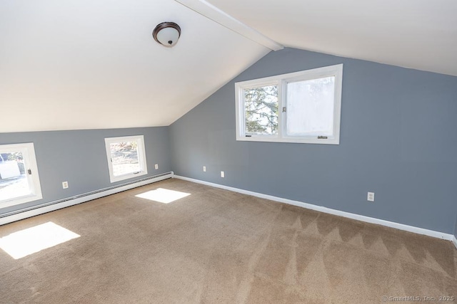 bonus room with a baseboard radiator, vaulted ceiling, carpet flooring, and a wealth of natural light