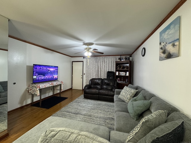 living room with ornamental molding, ceiling fan, and dark hardwood / wood-style flooring