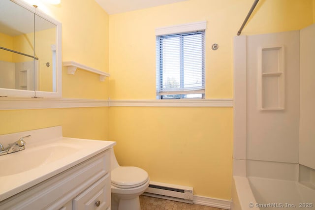 full bathroom featuring vanity, bathing tub / shower combination, baseboard heating, and toilet