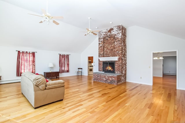 living room with a baseboard radiator, lofted ceiling, ceiling fan, a brick fireplace, and light wood-type flooring